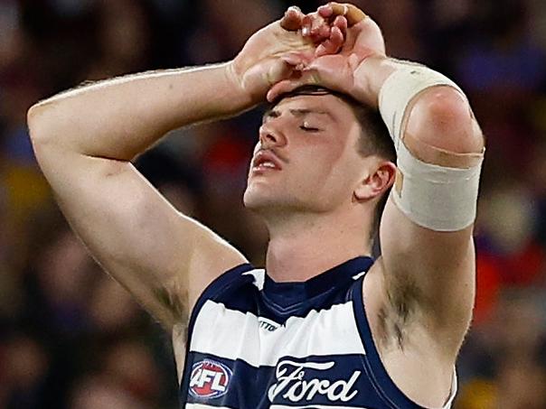 MELBOURNE, AUSTRALIA - SEPTEMBER 21: Jack Henry (ledt) and Oliver Henry of the Cats look dejected after a loss during the 2024 AFL Second Preliminary Final match between the Geelong Cats and the Brisbane Lions at The Melbourne Cricket Ground on September 21, 2024 in Melbourne, Australia. (Photo by Michael Willson/AFL Photos via Getty Images)