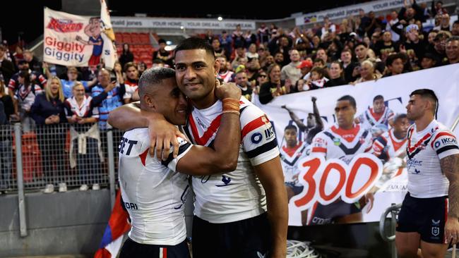 Michael Jennings (left) celebrates playing 300 games with Daniel Tupou of the Roosters after the win. (Photo by Cameron Spencer/Getty Images)