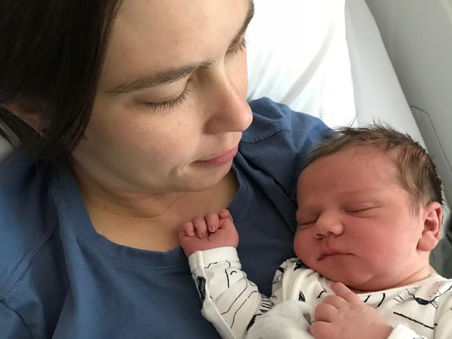 Jess Brooks with newborn son Alfie. Ms Brooks copped a $112 parking fine while giving birth. Picture: Supplied