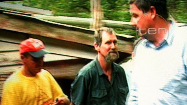 William Kelvin Fox being escorted away by police after his recapture. Picture: Channel 10