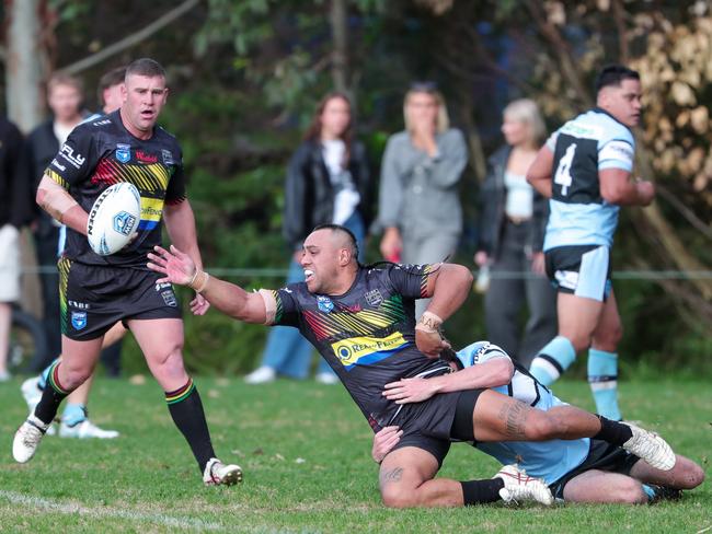 Panthers five-eighth Tori Willie gets a pass away as captain Thomas Romer looks on. Picture: Adam Wrightson Photography