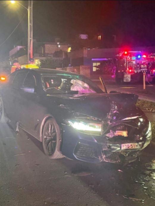 The man’s BMW M5 smashed into parked cars with two children in the car. Picture: 2GB