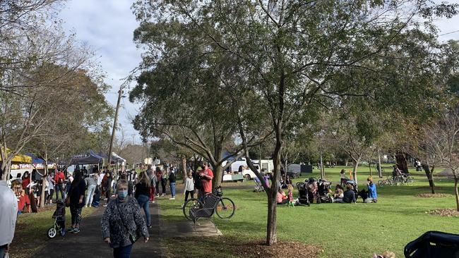 This photo of Yarraville farmers’ market has drawn criticism on market organisers for the behaviour of people not following health protocols. Yarraville farmers’ market manager said the people in the photo on the right were not customers of the market. Picture: Brianna Travers