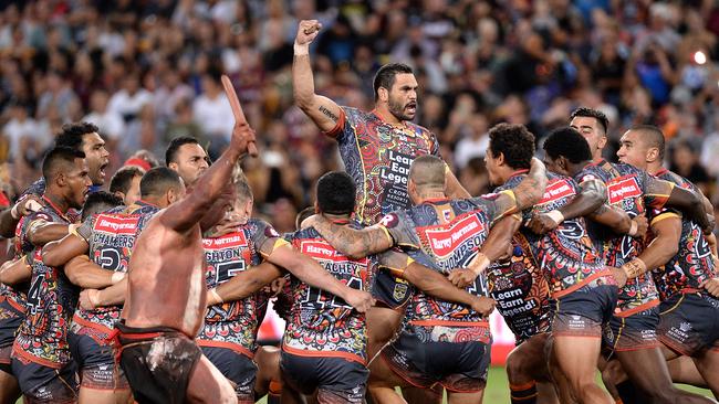 BRISBANE, AUSTRALIA - FEBRUARY 13: Greg Inglis of the Indigenous All Stars and team mates performs a cultural dance before the NRL match between the Indigenous All-Stars and the World All-Stars at Suncorp Stadium on February 13, 2016 in Brisbane, Australia. (Photo by Bradley Kanaris/Getty Images)