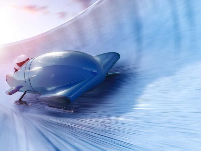 Bobsleigh team is riding on a high speed in a turn - full 3D