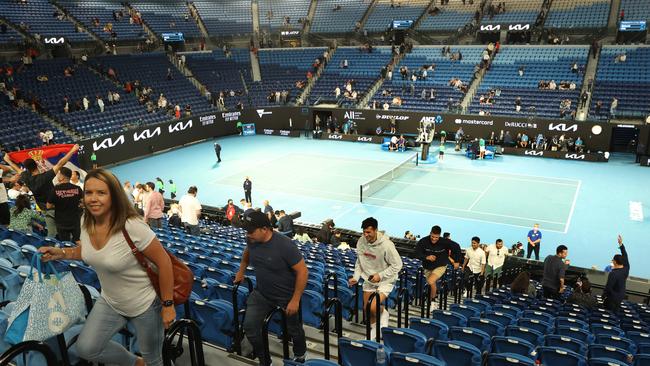 Fans exit Rod Laver Arena. Picture: Michael Klein