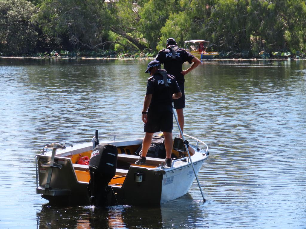 Water police, police divers and SES crews searching the Ross River shortly after Robert Malayta vanished.