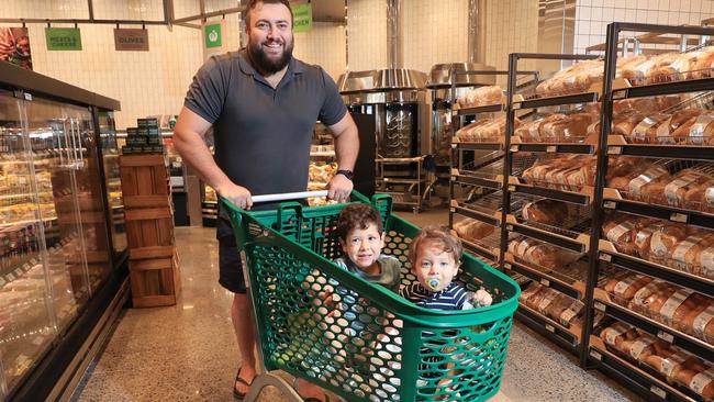 Brett Campbell and his sons Jack Campbell, 4, and Luke Campbell, 2, do their weekly shop in the fresh bakery section. Picture: Brendan Radke