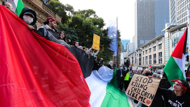 SYDNEY, AUSTRALIA - NewsWire Photos MAY 15, 2021: Members of the public gather at Sydney Town Hall to commemorate the catastrophic massacres of Palestinians in 1948 which caused the displacement and destruction of over 700,000 Palestinians who were uprooted from their homes and over 500 villages were eradicated. Today people gather around the world to protest, demanding Israel ends its ethnic cleansing of the Palestinian people, in Sydney, Australia. Picture: NCA NewsWire / Gaye Gerard