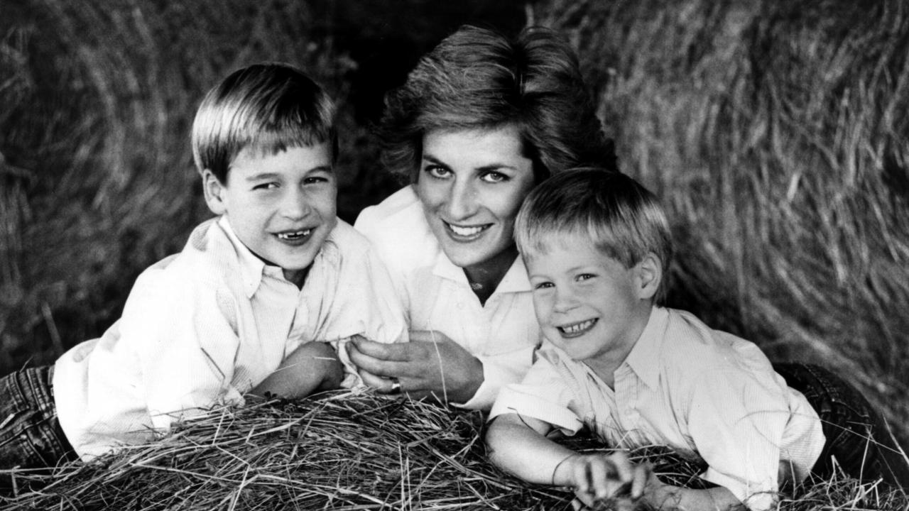 <b>1990:</b> Prince Harry poses with his mother Princess Diana and brother Prince William for a poignant family portrait. Behind the scenes, the marriage of Diana and Charles was in serious trouble.