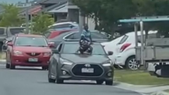 The boy was filmed riding on the windscreen of a car in Melbourne. Picture: Channel 9