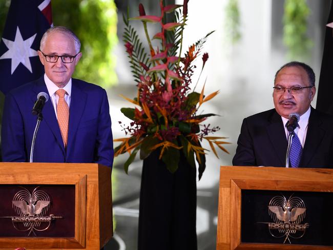 Australian Prime Minister Malcolm Turnbull (left) and Papua New Guinea's Prime Minister Peter O'Neill speak to the media during a joint press conference in Port Moresby, Papua New Guinea, Saturday, April 8, 2017. Mr Turnbull is in Papua New Guinea on a two-day official visit. (AAP Image/Lukas Coch) NO ARCHIVING