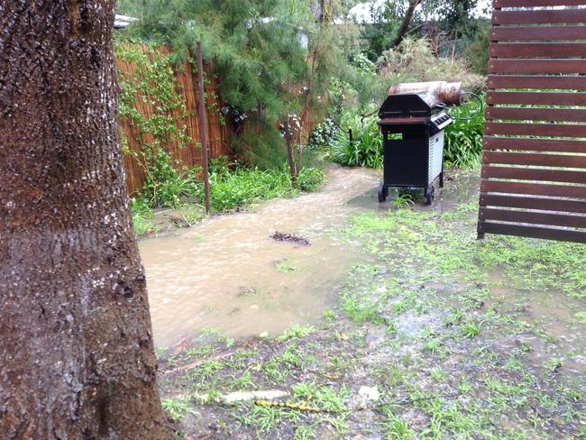 A barbecue sits on soggy ground. Picture: Mark Baryczka