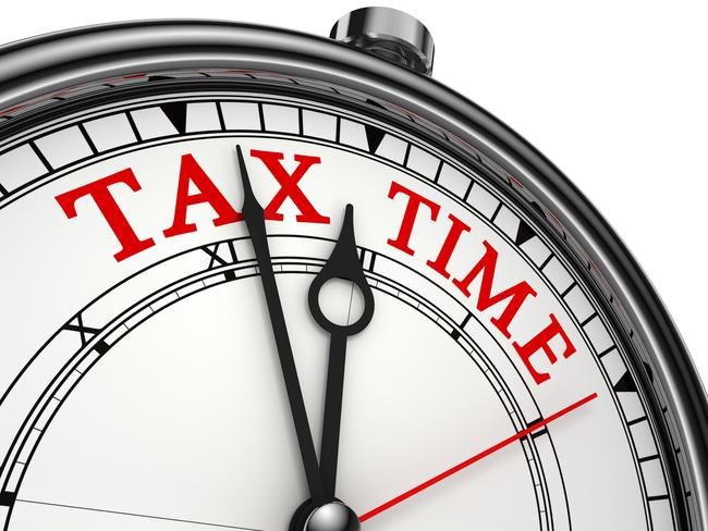 tax time concept clock closeup isolated on white background with red and black words.  tax clock, tax time countdown generic