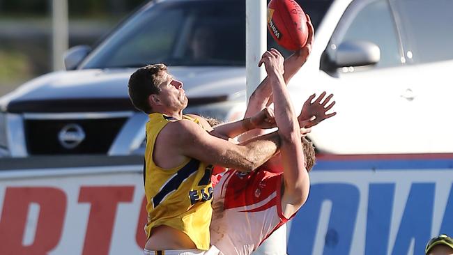 North Warrnambool Eagles player Nathan Vardy tries to win the ball against a South Warrnambool player. Picture Yuri Kouzmin