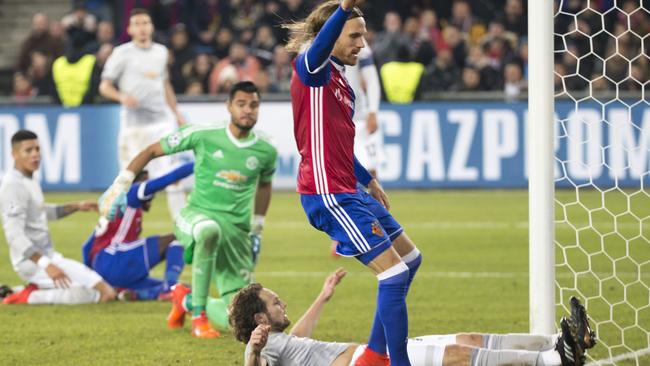 Basel's Michael Lang, foreground, celebrates after scoring a goal.
