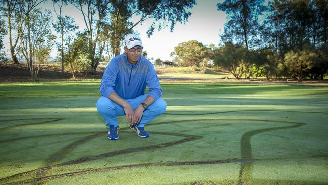 Damage caused to the golf course at Munno Para West in 2018 inspected by greenkeeper Adam Mitchell. Picture: AAP/Mike Burton