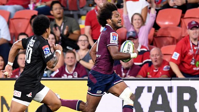 Henry Speight streaks away to score for the Reds. Picture: Getty Images