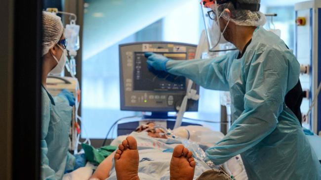 Nurses check a COVID-19 patient in the intensive-care unit of the Guillermo Grant Benavente Hospital in Concepcion, Chile. Picture: AFP