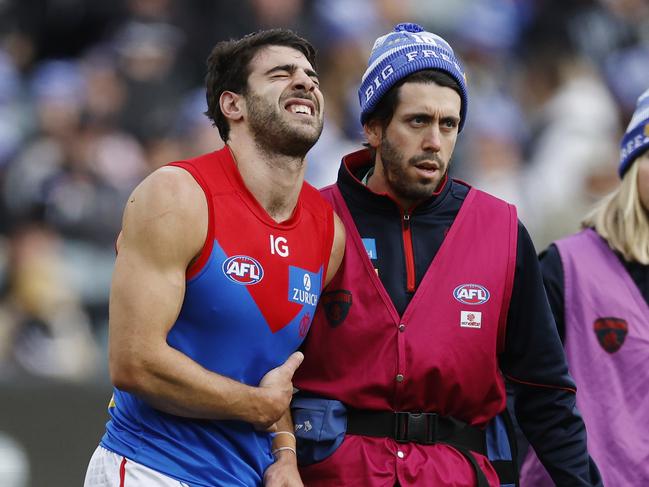 MELBOURNE, AUSTRALIAÃ June 10, 2024.  AFL Round 13. Big Freeze at the G. Collingwood vs Melbourne  at the MCG.   Christian Petracca of the Demons in pain after copping a Darcy Moore knee in the ribs late in the 1st qtr.       . Pic: Michael Klein