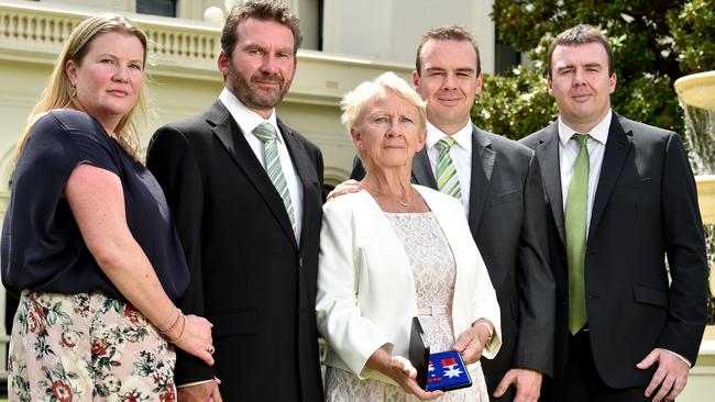 Bridget O’Toole, with family, receives the award for her late husband Dermot. Picture: Jay Town