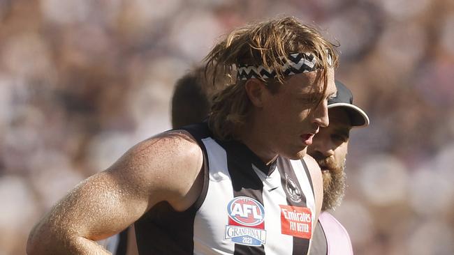 MELBOURNE, AUSTRALIA - SEPTEMBER 30: Nathan Murphy of the Magpies leaves the field with trainers during the 2023 AFL Grand Final match between Collingwood Magpies and Brisbane Lions at Melbourne Cricket Ground, on September 30, 2023, in Melbourne, Australia. (Photo by Daniel Pockett/AFL Photos/via Getty Images)