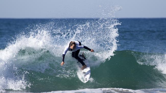 Young Wooli surfer Carly Shanahan competing in a junior event.