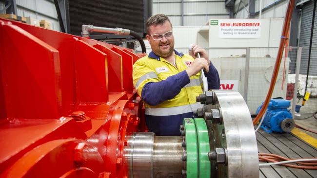 Mackay, 29 Nov 18, Mackay Mining Service Industries benefit from Adani Mining Go Ahead.Adam Hawes, Workshop Supervisor at SEW Eurodrive, working on their drive system Balancer.Photo : Daryl Wright.