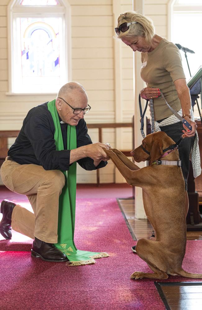 Prudence receives a Blessing from Reverend Graham Warren with her owner Suzie Lyons at the Blessing of the Pets at All Saints Anglican Church, Saturday, October 12, 2024. Picture: Kevin Farmer