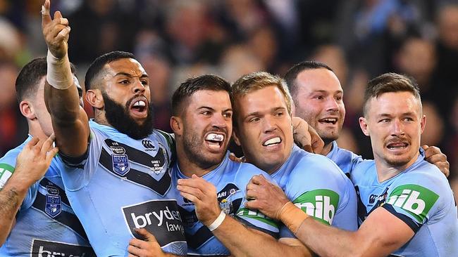 MELBOURNE, AUSTRALIA - JUNE 06: Jake Trbojevic of the Blues is congratulated by team mates after scoring a try during game one of the State Of Origin series between the Queensland Maroons and the New South Wales Blues at the Melbourne Cricket Ground on June 6, 2018 in Melbourne, Australia. (Photo by Quinn Rooney/Getty Images)