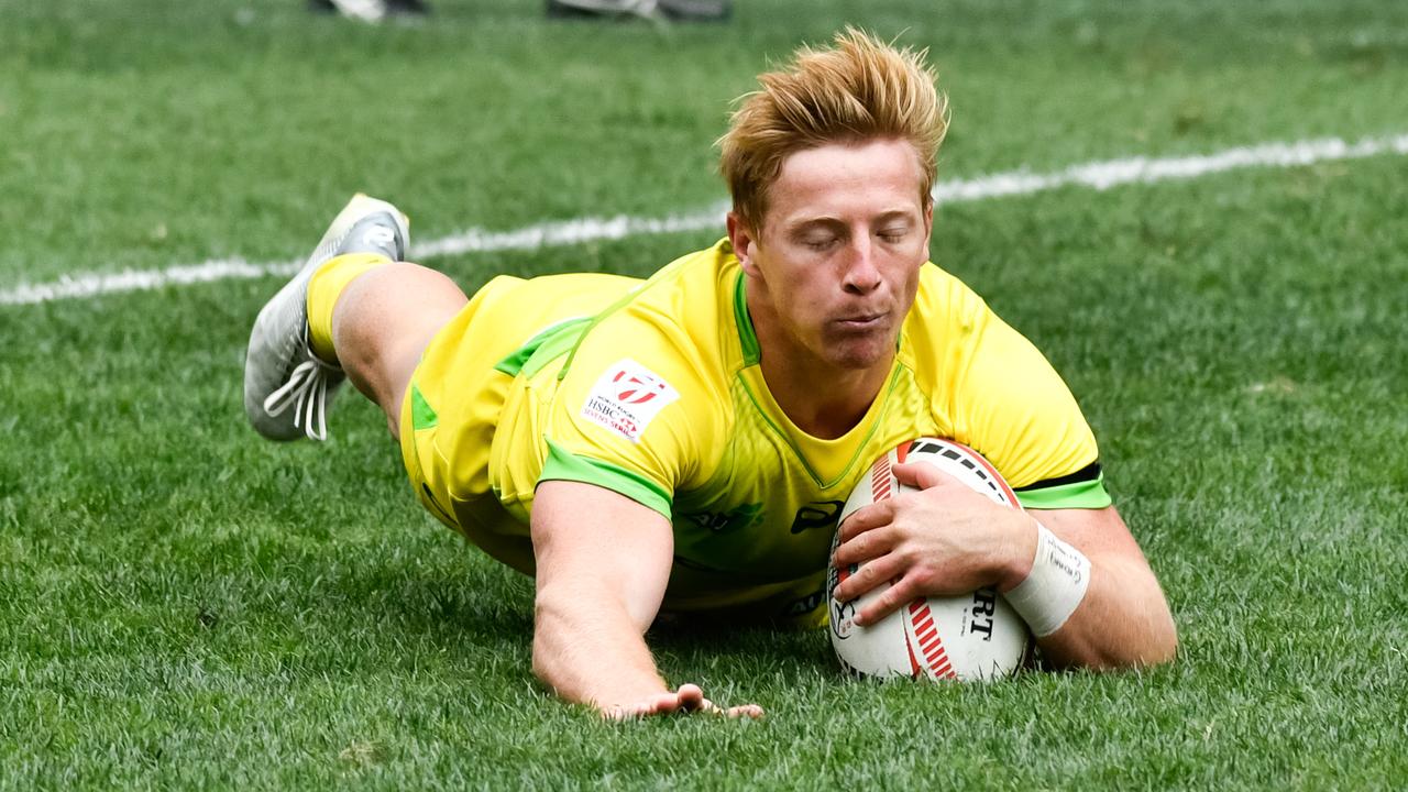Lachie Miller of Australia dives in to score a try at the Hong Kong Sevens.