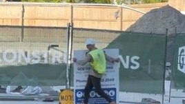 GCB Constructions workers removed signage and site huts from the Drift development at Hughes Ave, Main Beach on Friday morning May 12. Picture: Gold Coast Bulletin