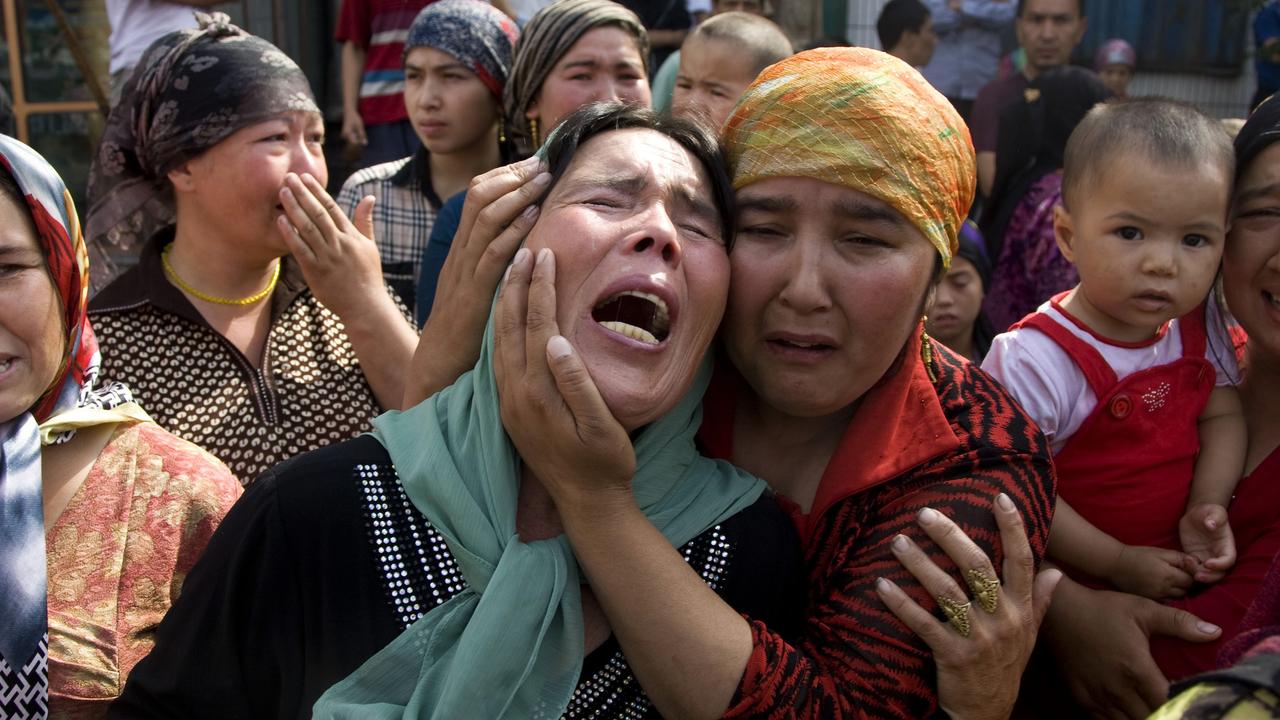 Uyghur women grieve for their men who were taken away by Chinese authorities in a crackdown on the Muslim minority group.