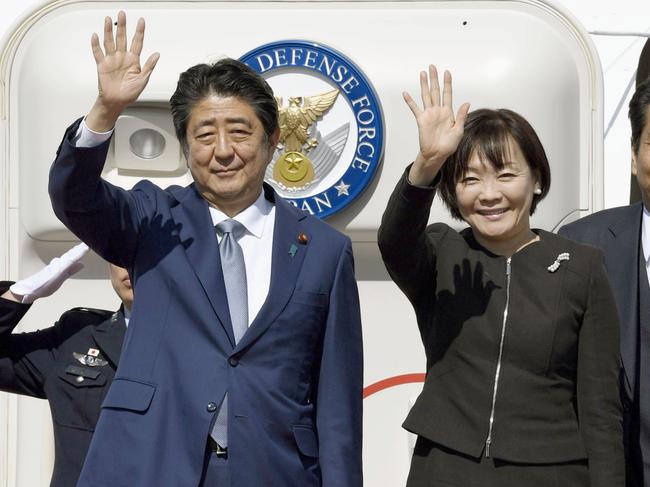 Japanese Prime Minister Shinzo Abe and his wife Akie wave at Haneda airport in Tokyo on Oct. 25, 2018, before leaving for China. (Kyodo) ==Kyodo (Photo by Kyodo News via Getty Images)