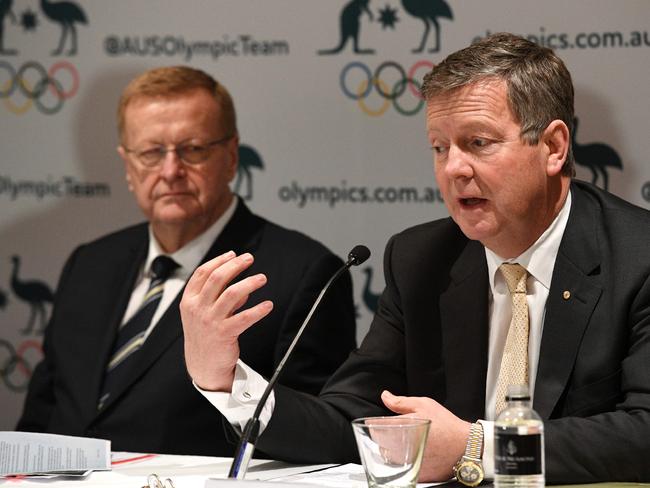 (FILES) In this file photo taken on August 24, 2017 Australian Olympic Committee (AOC) chief executive officer Matt Carroll (R) speaks beside AOC president John Coates during a press conference in Sydney. - Australian Olympic chiefs on March 19, 2020 reaffirmed plans to send athletes to Tokyo 2020, even as a former top official warned it looked impossible to hold the Games during the coronavirus pandemic. (Photo by William WEST / AFP)