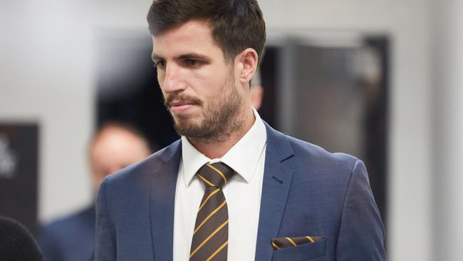 Hawthorn captain Ben Stratton leaves the AFL tribunal.