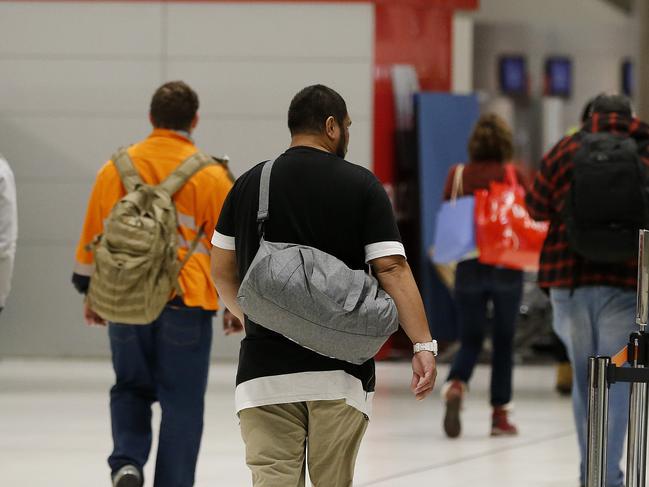 Passengers pictured arriving from Melbourne at the Brisbane Domestic Airport, Brisbane 23rd of June 2020.  Melbourne has had spike of Covid-19 cases in the past week.  (Image/Josh Woning)