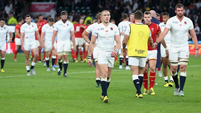 LONDON, ENGLAND - SEPTEMBER 26: Mike Brown of England and Tom Wood of England walk off dejected following defeat during the 2015 Rugby World Cup Pool A match between England and Wales at Twickenham Stadium on September 26, 2015 in London, United Kingdom. (Photo by David Rogers/Getty Images)