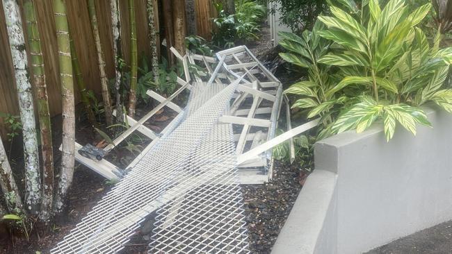 Smashed roller doors that were ripped off by car thieves at Cairns One. Picture: Supplied