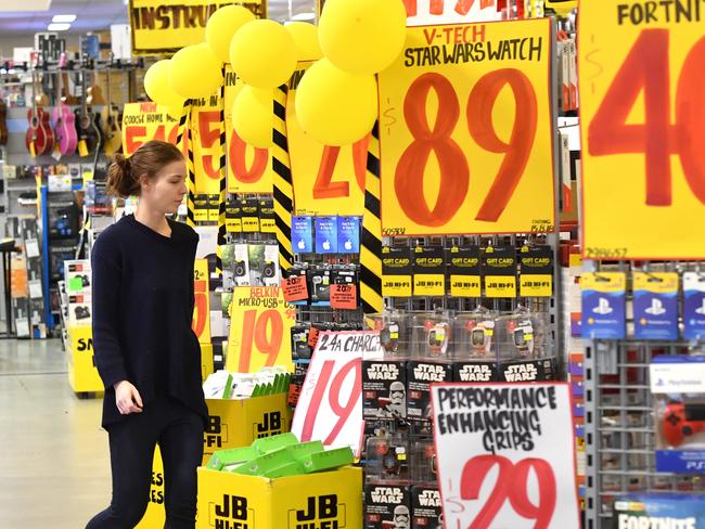 A customer is seen inside a JB Hi-Fi store in Brisbane, Monday, August 13, 2018. JB Hi-Fi's full yet net profit jumps 35 per cent to $232.2 million, thanks to strong demand for its consumer electronics. (AAP Image/Darren England) NO ARCHIVING