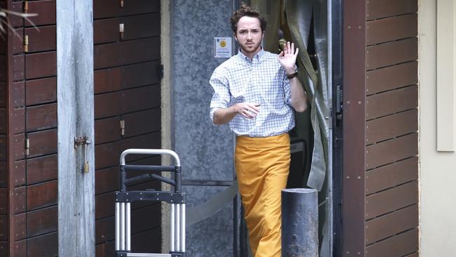 A staff member receiving deliveries from a side door. Picture: David Caird