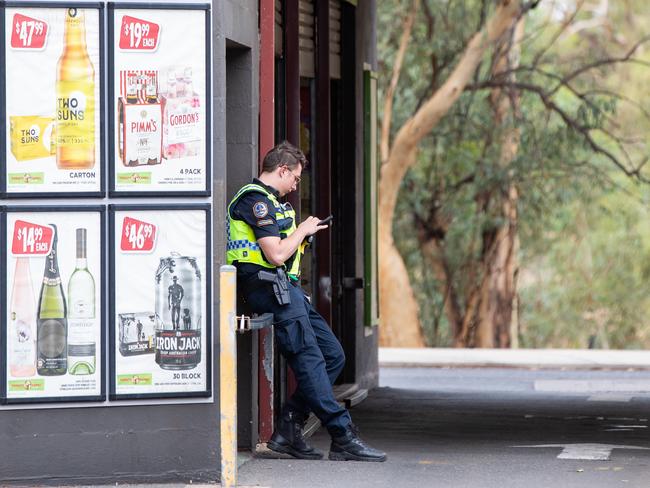 Police outside a bottle shop in Alice Springs