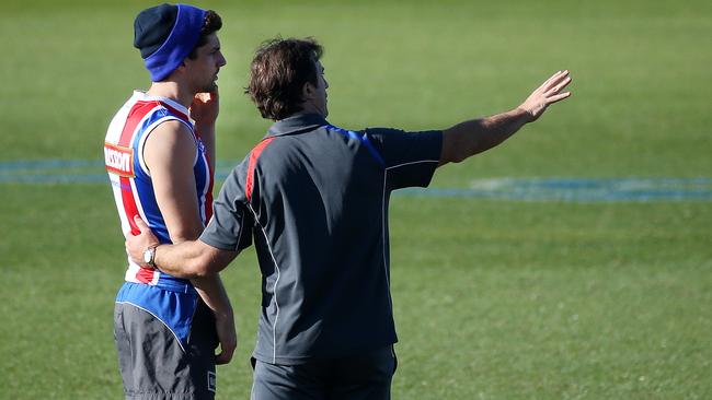 Tom Liberatore talks with Luke Beveridge last season. Picture: George Salpigtidis