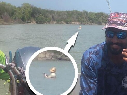 <s1>Daniel Nielsen-Titus sits in disbelief in his boat while the idiotic fisherman behind him stands shoulder deep in water at croc-infested Shoal Bay’s Hope Inlet </s1>                        <ld pattern=" "/>                        <source>Picture: </source>: Simon Bochow