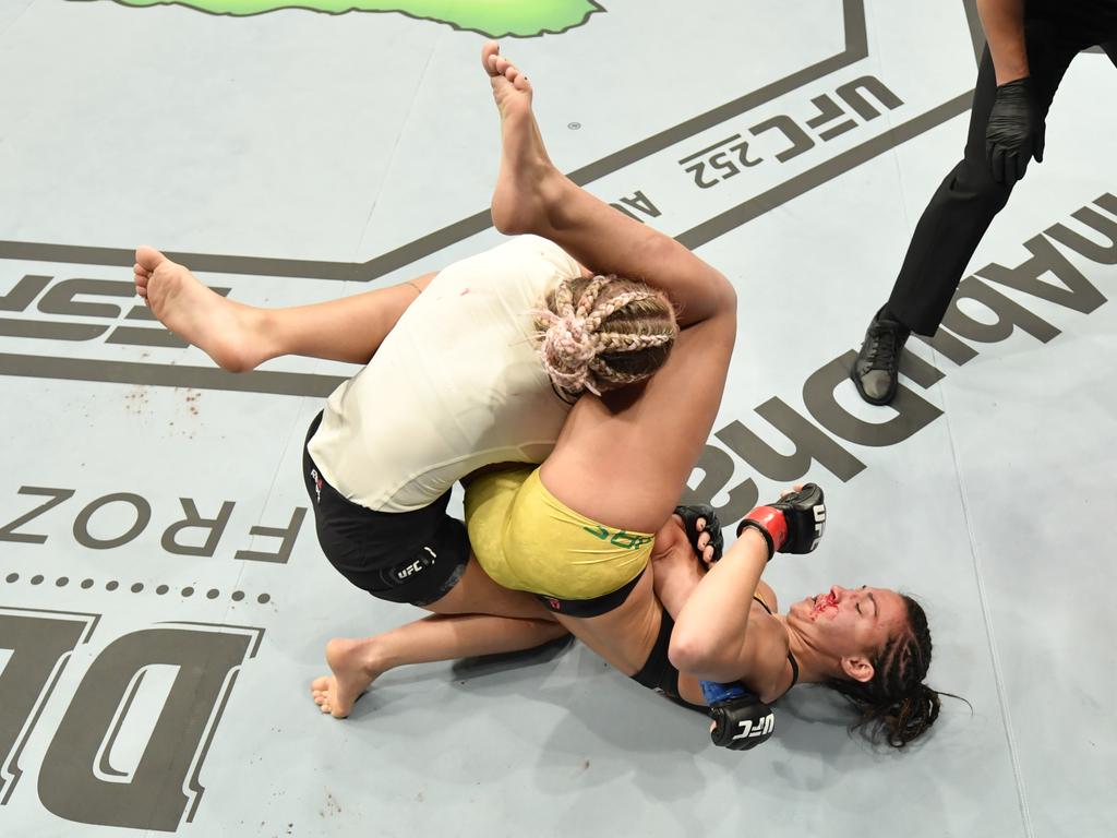 Amanda Ribas secures an arm bar submission against Paige VanZant. (Photo by Jeff Bottari/Zuffa LLC via Getty Images)