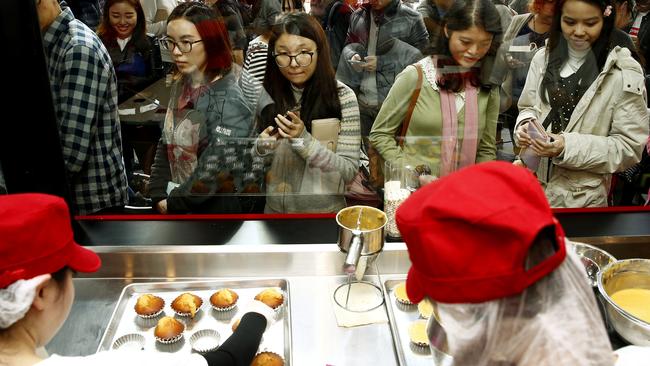Thousands have lined up to get their hands on a freshly baked cheesecake from Uncle Tetsu’s new store on George St. Picture John Appleyard