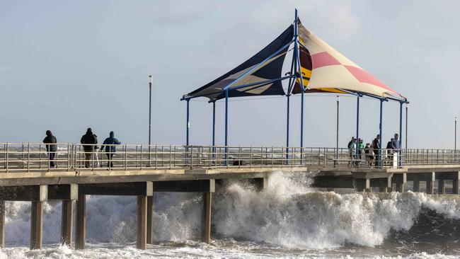 June 7, 2025: People watching the big waves on Brighton Jetty. Picture by Kelly Barnes