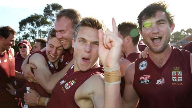 Hamish Latchford celebrates Prince Alfred Old Collegians’ 2016 Division One Adelaide Footy League premiership at Thebarton Oval. Picture: Stephen Laffer