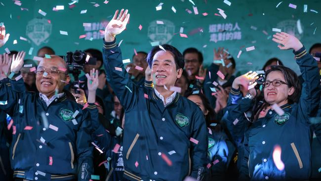 Confetti flies over the stage as William Lai, centre, is elected president in a historic election. Picture: Getty