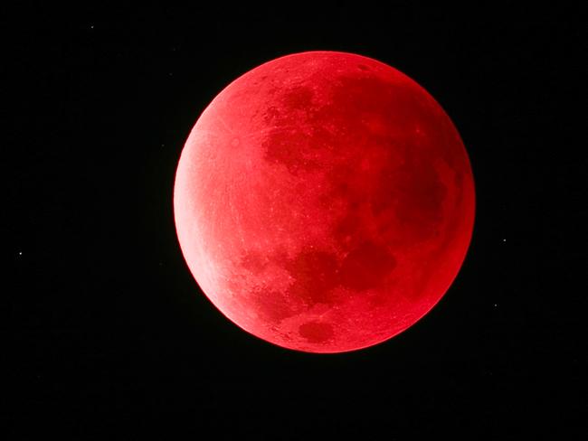 DO NOT PUBLISH BEFORE MIDNIGHT SATURDAY APRIL 2 -FOR SUNDAYS  Supermoon Eclipse 2015 © Peter FolkessonOn 28th September 2015, a supermoon coincided with a lunar eclipse, resulting in this photograph of the Moon appearing a striking shade of red. A lunar eclipse occurs when the Moon passes directly behind the Earth and is cloaked by our planet’s shadow and the only light that can be seen is refracted through it, creating the unusual colour of our natural satellite. Due to its red hue, a lunar eclipse is often referred to as a ‘Blood Moon’.  Boras, Sweden